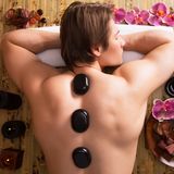 handsome-man-having-stone-massage-in-spa-salon-healthy-lifestyle